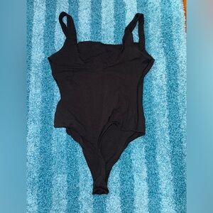 Skims squared neck thong bodysuit.